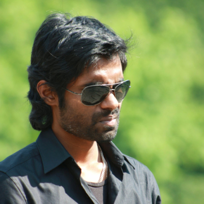 a man with a black shirt and sunglasses