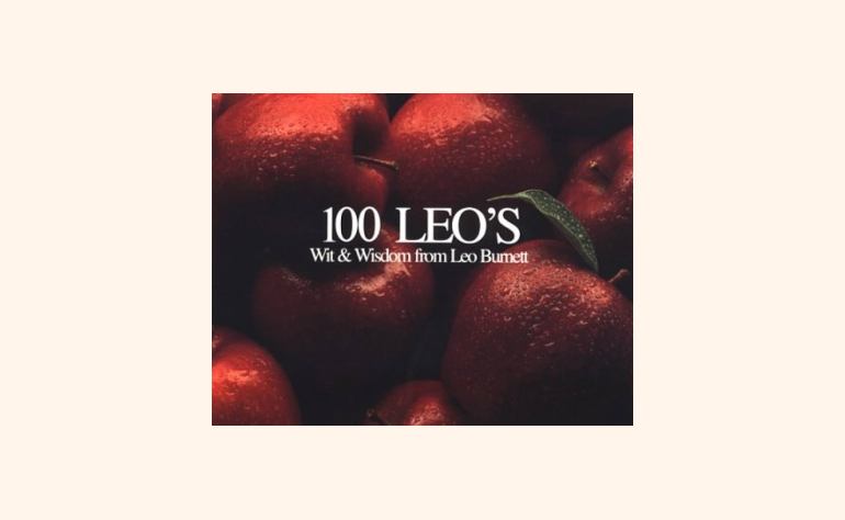 a picture of a pile of apples with the words 100 leos on it