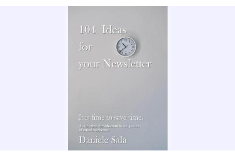 a white book with a clock on the cover