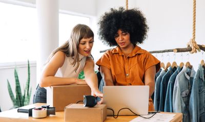 Two woman working together to manage an eCommerce store